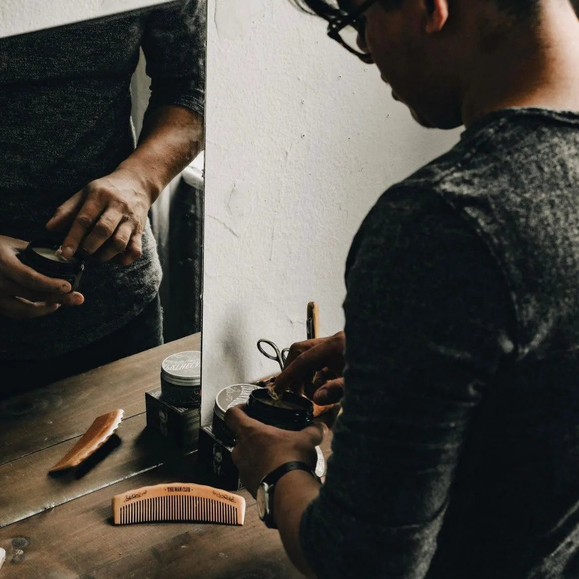 Apothecary 87 Matte Paste with man applying styling product. Part of the Matte Hair Kit gift