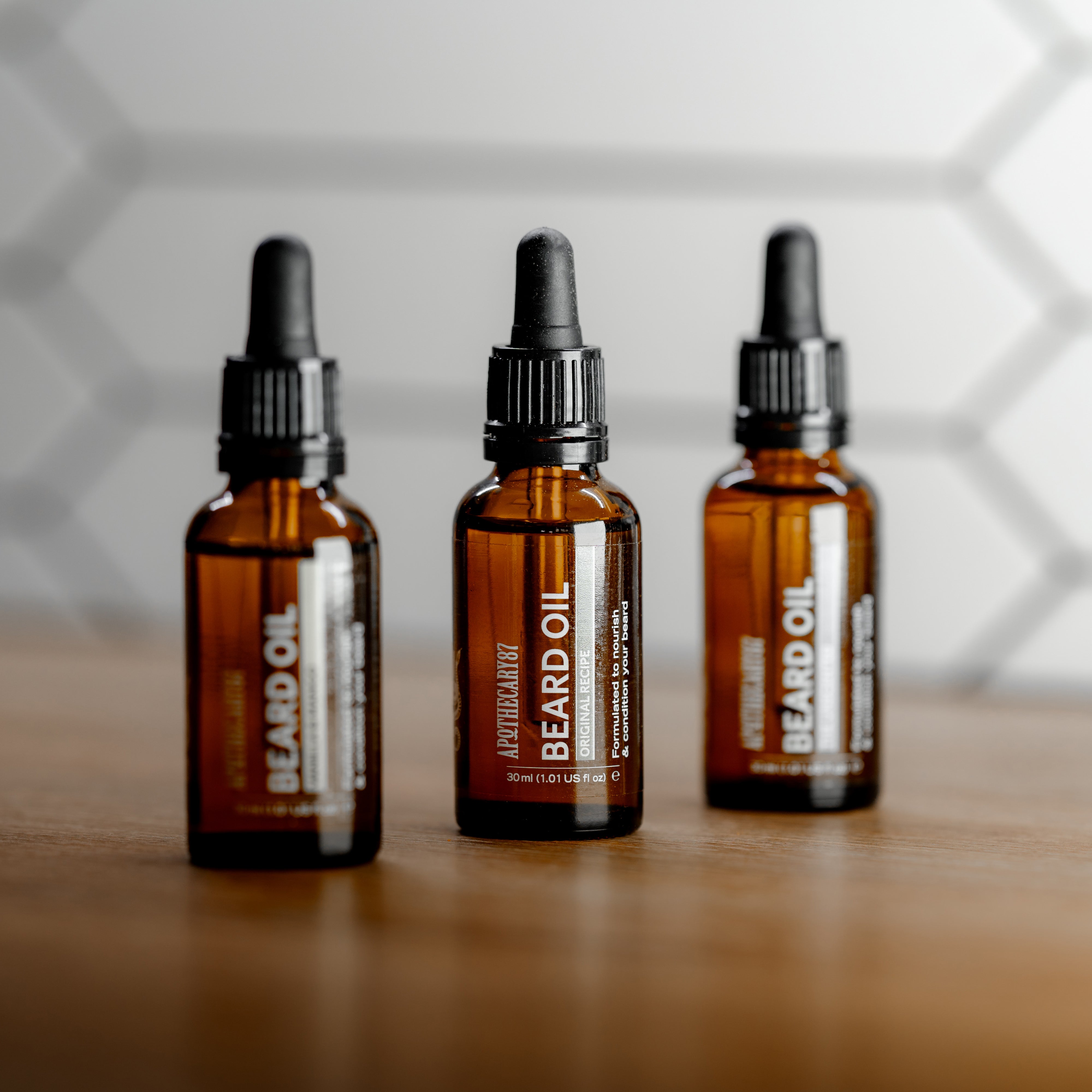 3 Apothecary 87 Beard Oils Lined Up