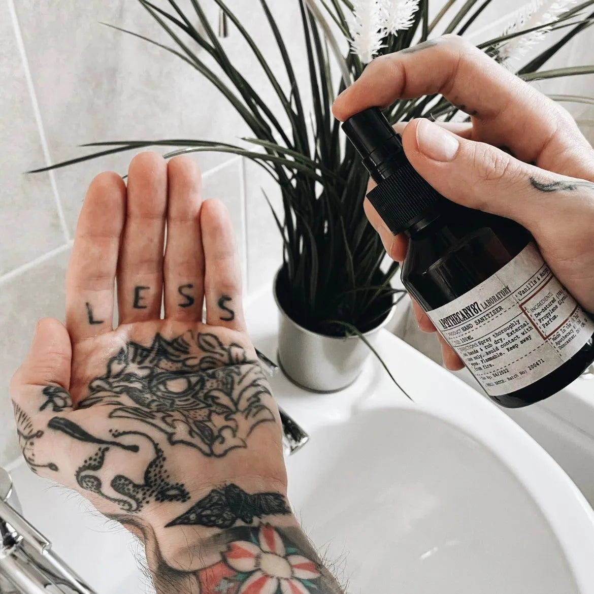 Apothecary 87 sanitising spray Hand Sanitiser, sprayed onto tattoo hand