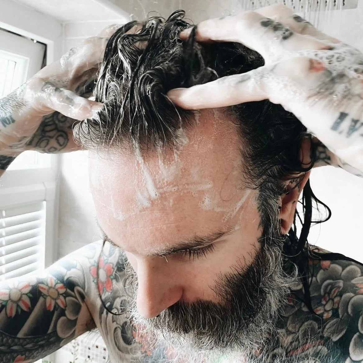 Apothecary 87 healthy hair Botanical Shampoo used in shower by man for nourished hair