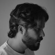 Apothecary 87 texturising Salt Tonic used by man for natural finish hair style