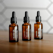 Apothecary 87 conditioning Beard Oil bottles in line. Classic and woody scent