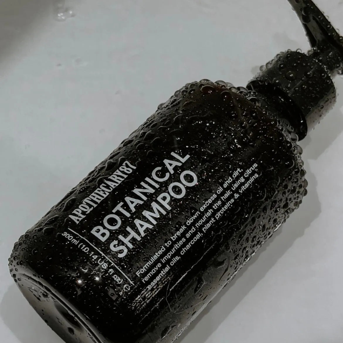 Apothecary 87 hair nourishing Botanical Shampoo in bath for keeping hair clean
