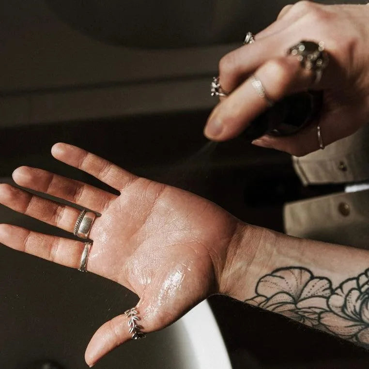 Apothecary 87 cleansing Hand Sanitiser sprayed onto skin