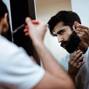Apothecary 87 Beard Set bundle including everything for healthy beard care. Gift set showcasing man applying beard oil