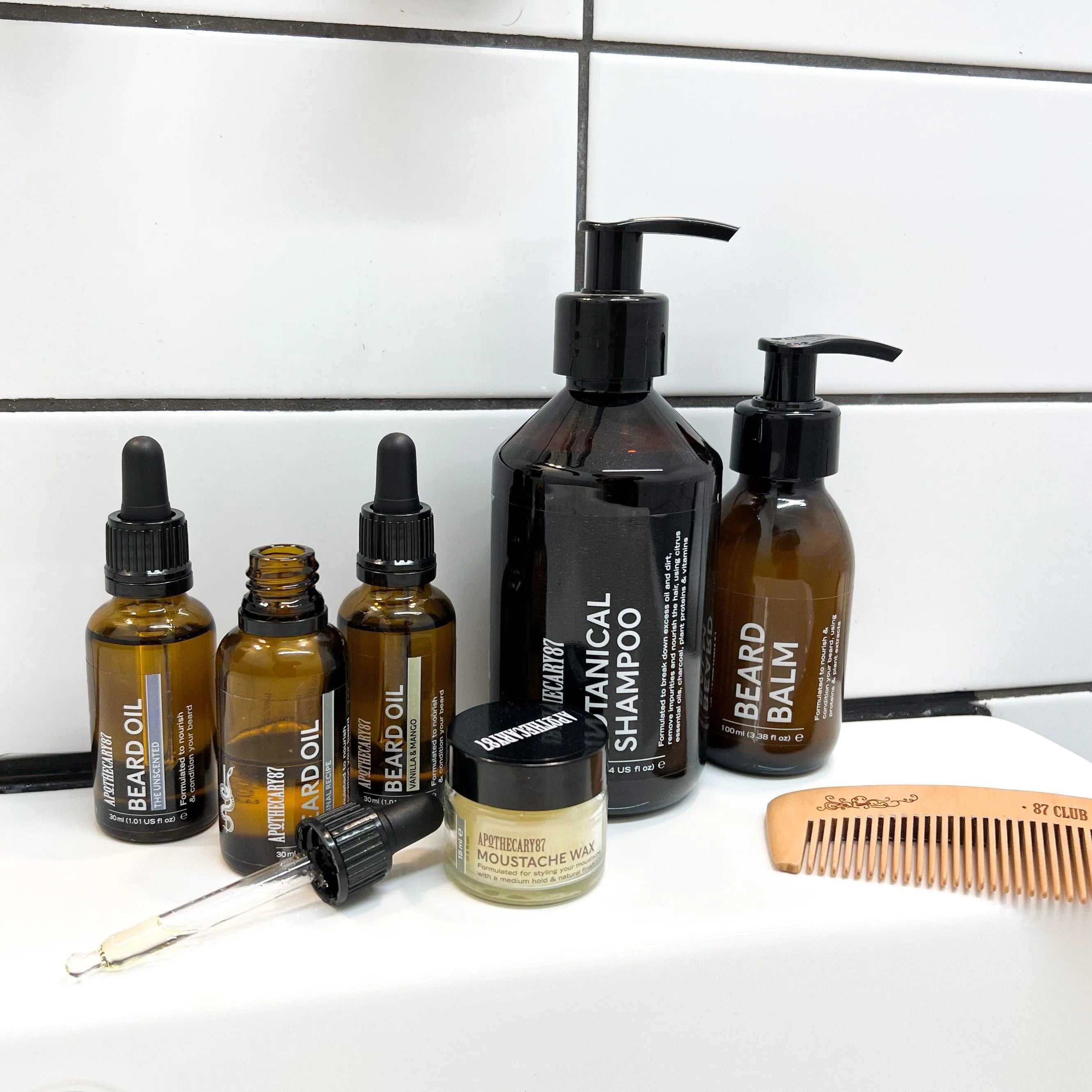 Apothecary 87 Beard Set bundle including everything for healthy beard care. Gift set with shampoo, beard oil, beard balm, comb, moustache wax